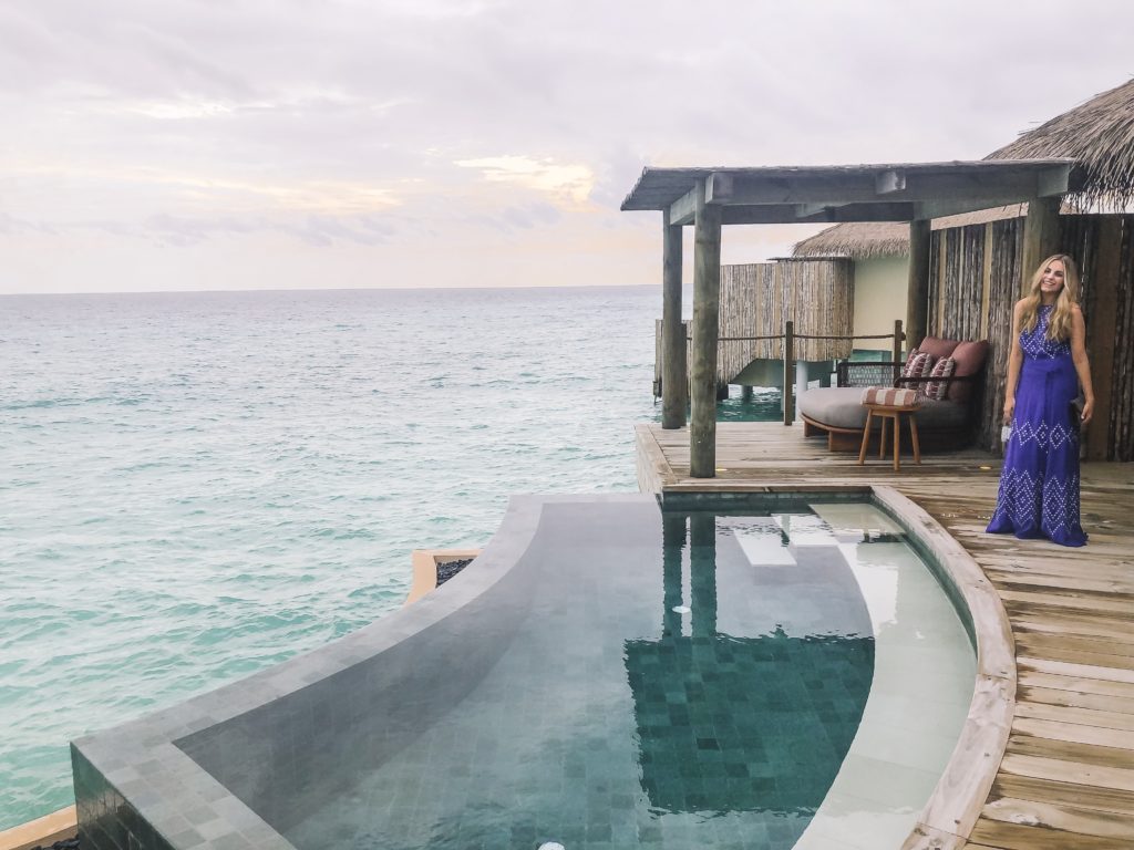 The luxury travel copywriter in an overwater villa 